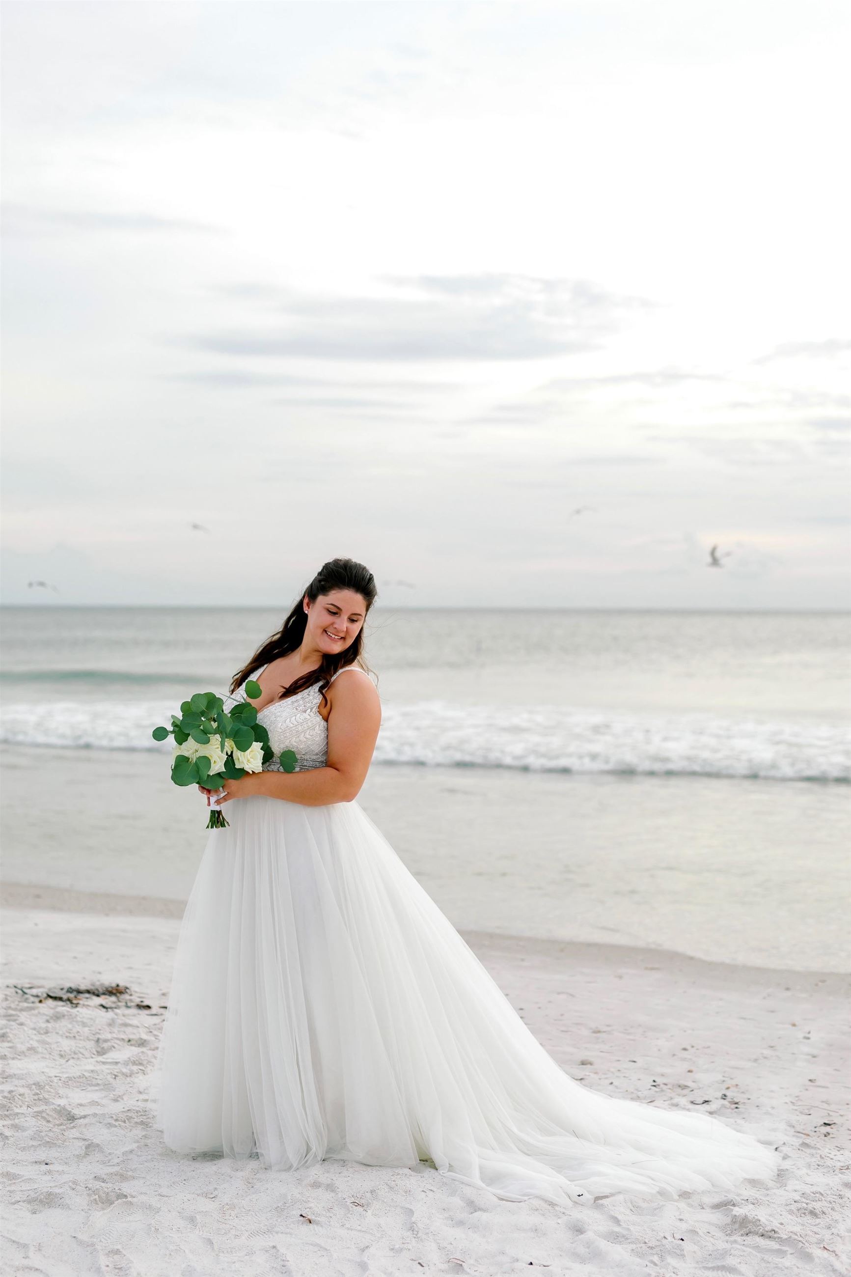 Bride by a body of water